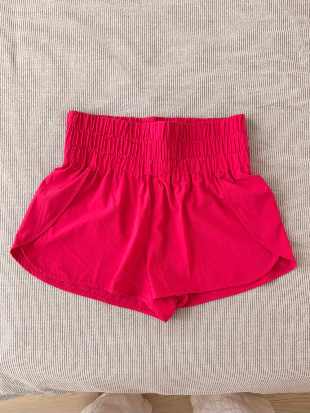 Hot pink high-waisted athletic shorts with elastic waistband, Size S